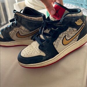 Nike Air Jordan High Tops - Black, Gold, Red take flight